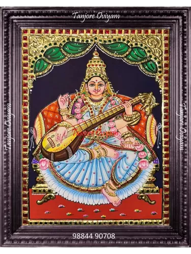Traditional Saraswathi Tanjore painting with veena, lotus and gold foil detailing